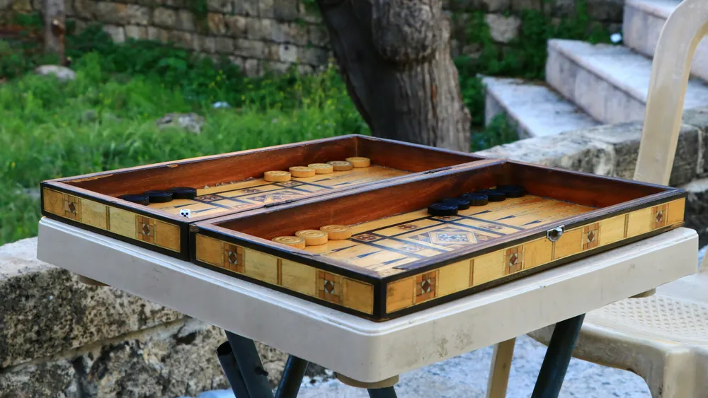 Wooden backgammon case opened outdoors